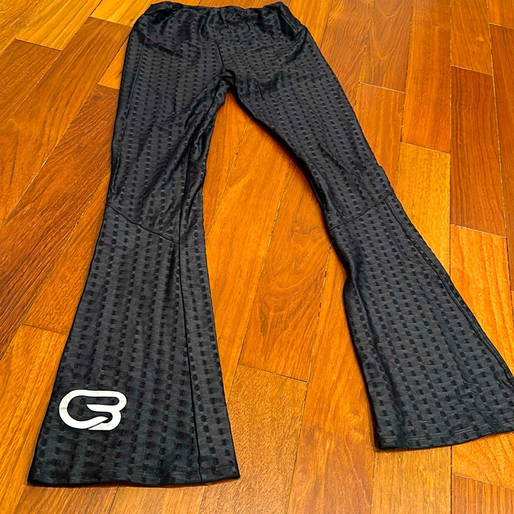Pheel flare leggings with CycleBar logo on front ankle
